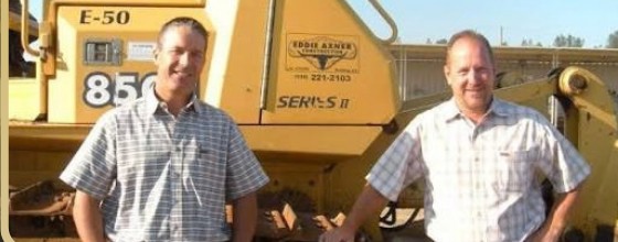 Eddie Axner Construction crew in front of company equipment