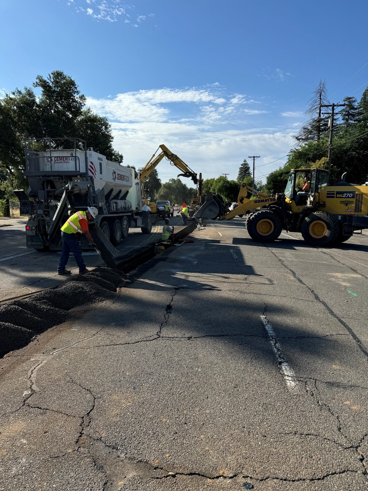 Caterpillar scraper performing commercial site grading